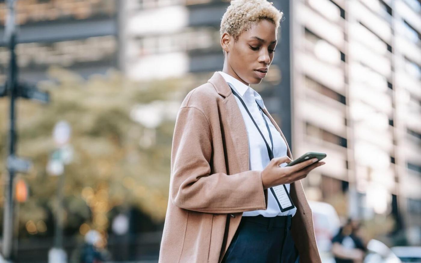 Businesswoman looking at her phone